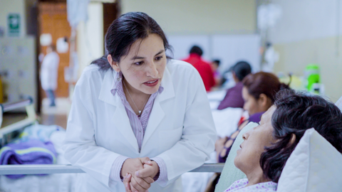 A doctor talks to a patient at a hospital in Peru.